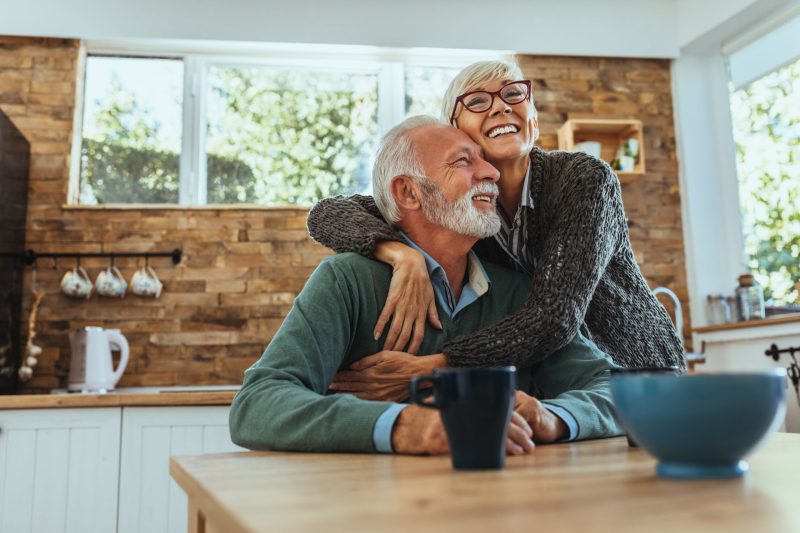 Mature,Woman,Hugging,Her,Husband Healing Time After Tooth Extraction and Mini Implant Placement